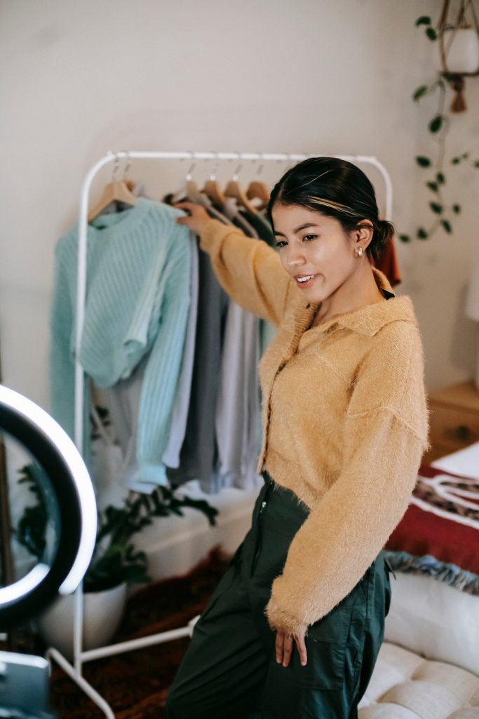 Woman showcasing fashion choices during video interview