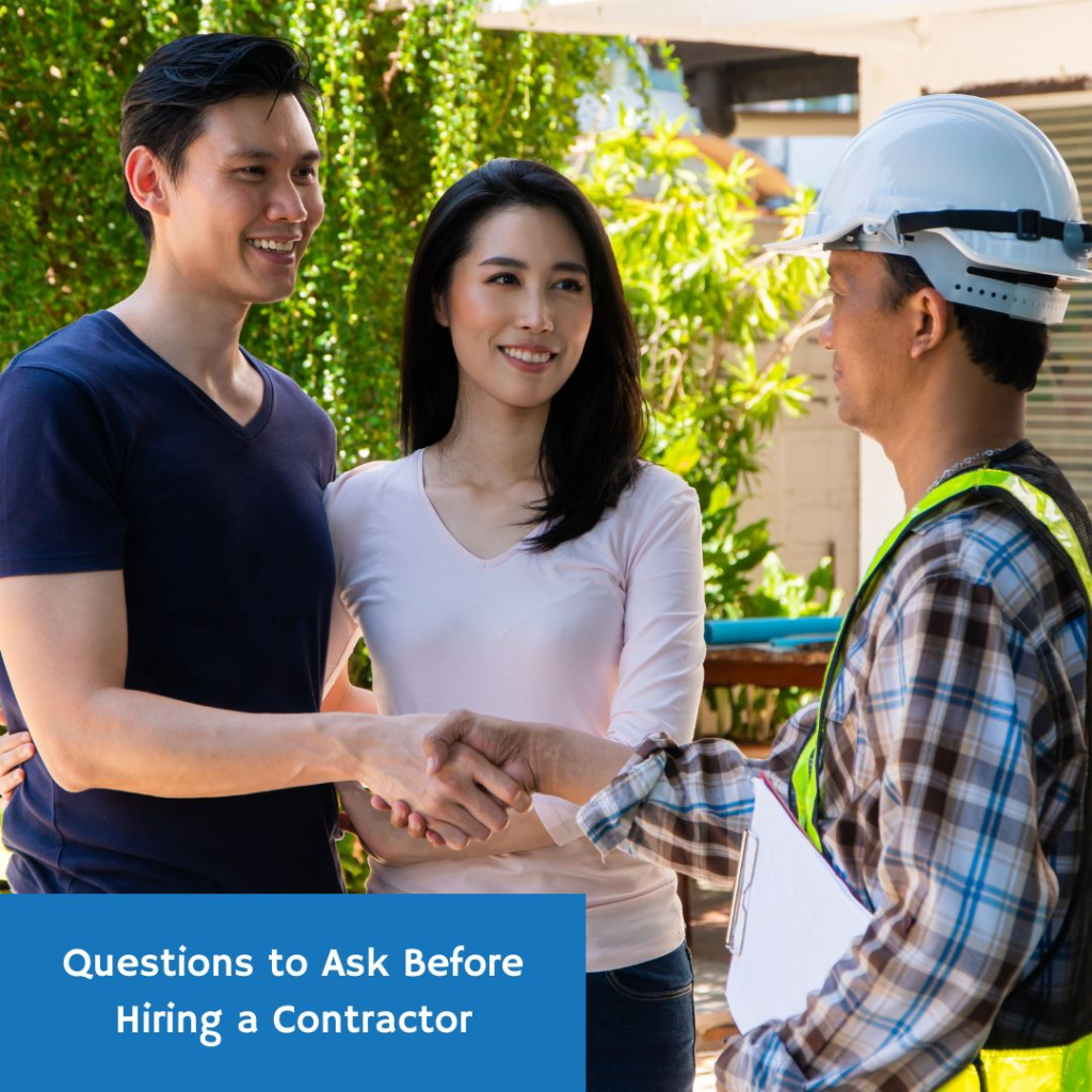 A man and a woman shaking hands with a construction worker